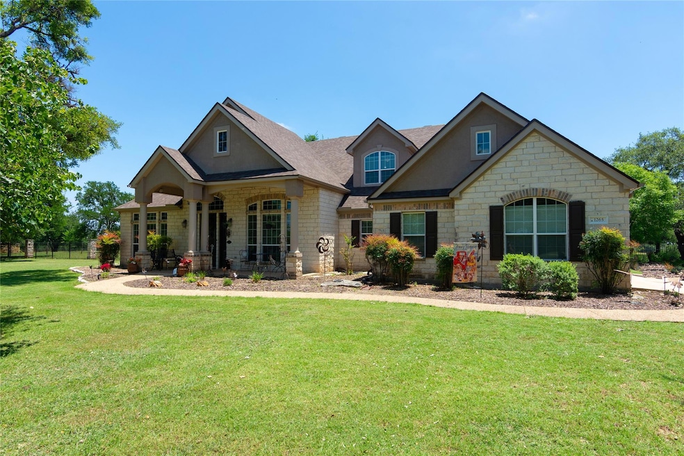 Craftsman-style house with stone siding, a porch,