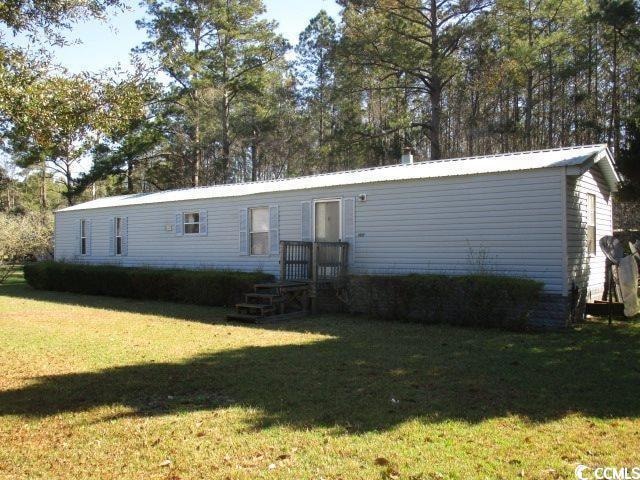 View of front of property featuring a front yard