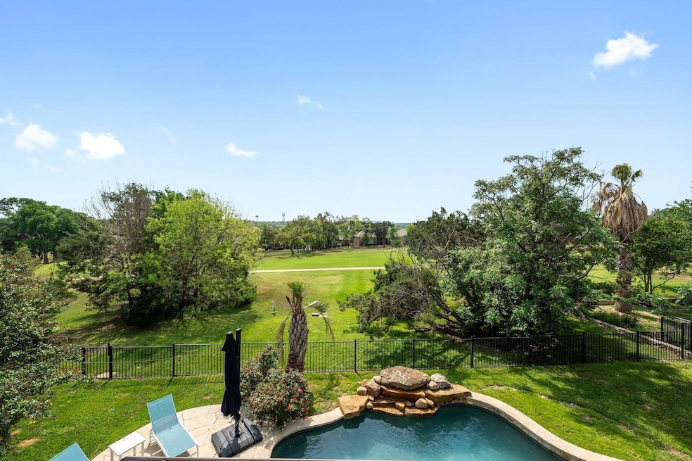 View of swimming pool featuring a fenced backyard