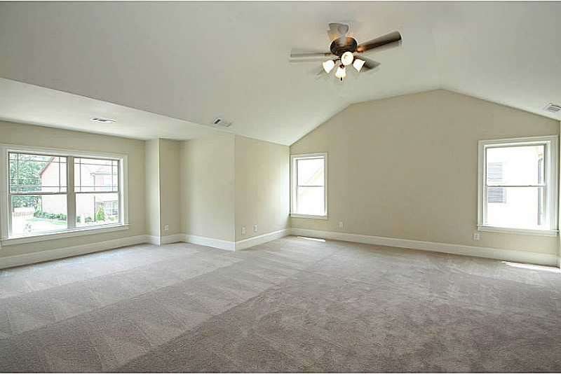HUGE Master Bedroom showing sitting area to the le