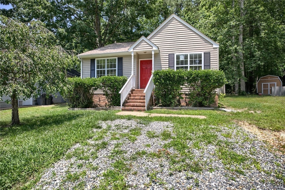 View of front of property with a front yard