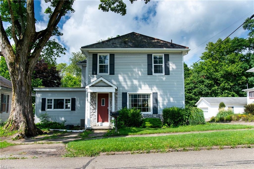 View of front of property with a front lawn