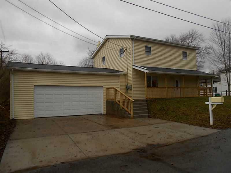 Exterior Front. Updated home with newer concrete i