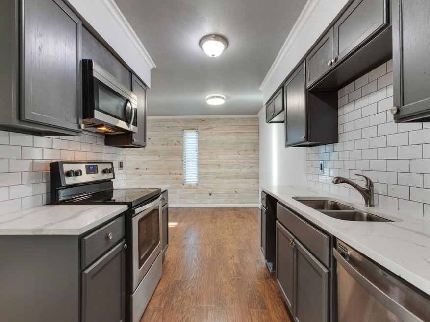 Gorgeous modern kitchen looking into dining room
