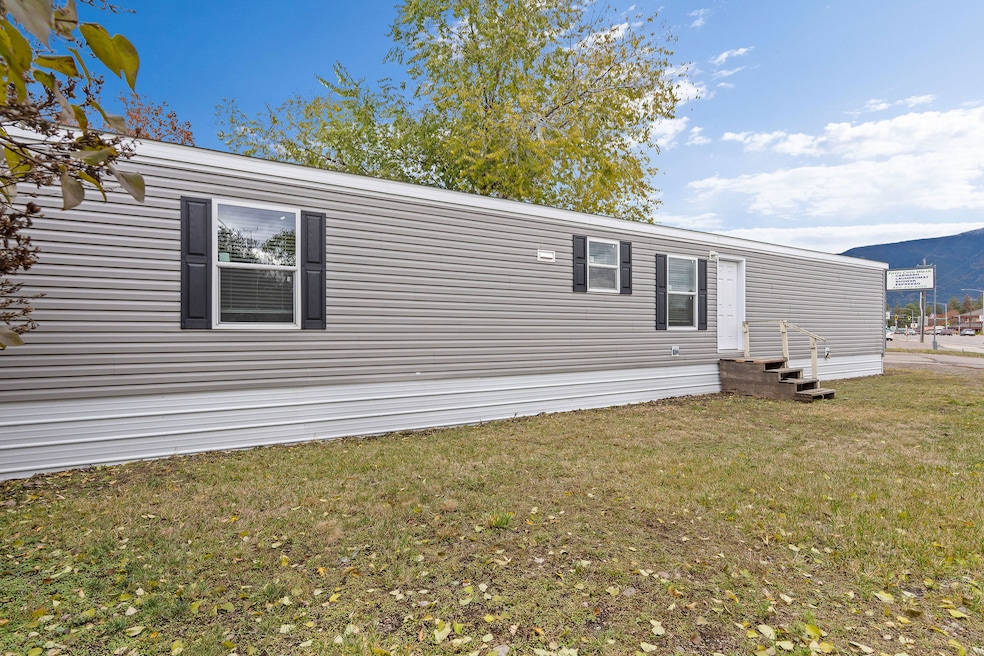 Side view of the 66' x 14' home, highlighting the excellent natural light and modern windows