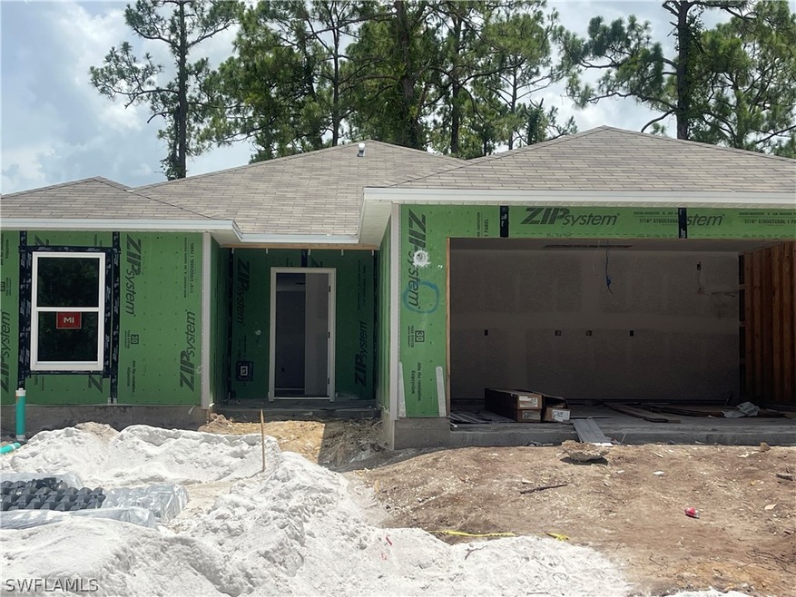 Property in mid-construction with a garage