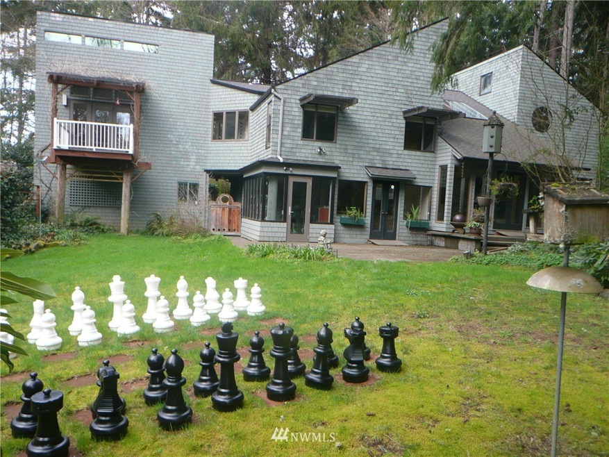 Your spacious new home complete with a yard chess set. Main suite is on the upper left above bedroom #4. The green house is behind lighter center door, then to the right access to kitchen, sun room and off to the right is the hot tub. IT'S YOUR MOVE.
