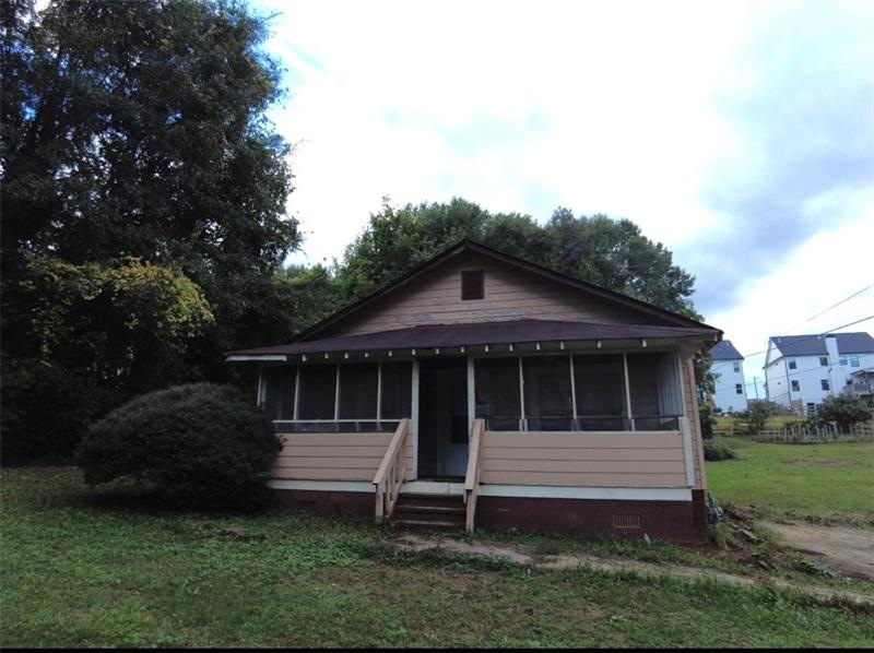 Front of home, featuring enclosed porch