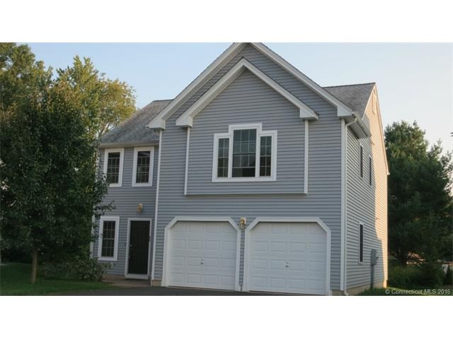 Newer Colonial set back in corner lot with private