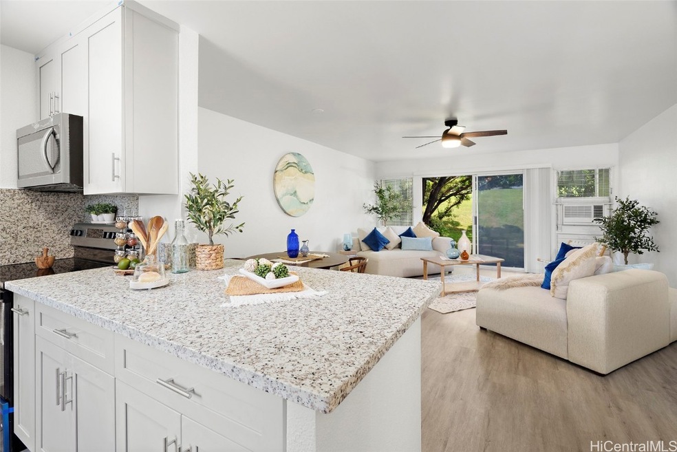 Contemporary open kitchen/living entertainment are
