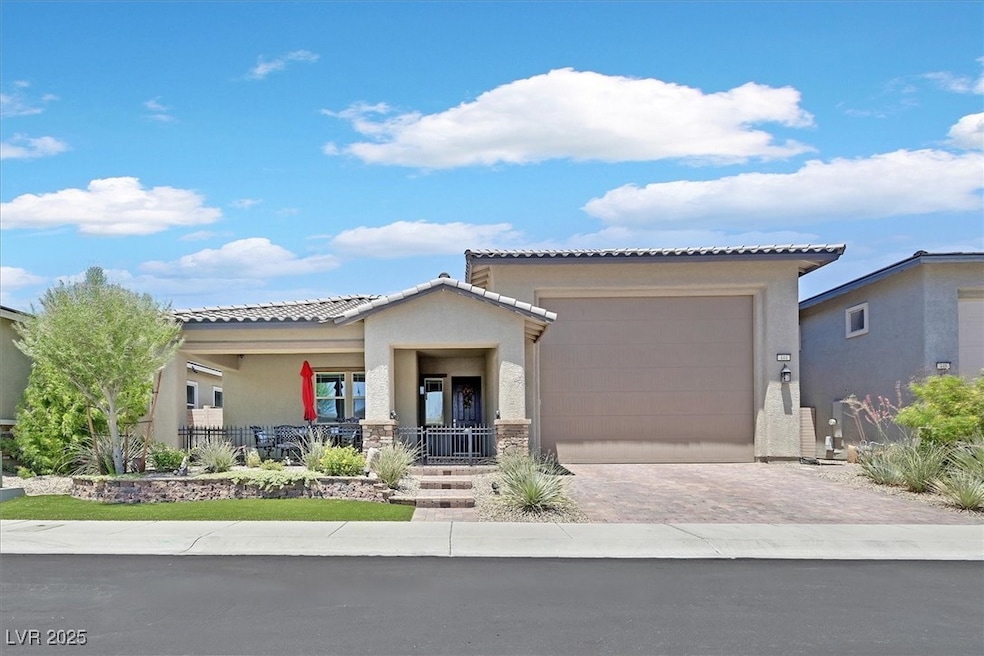 View of front facade featuring decorative driveway