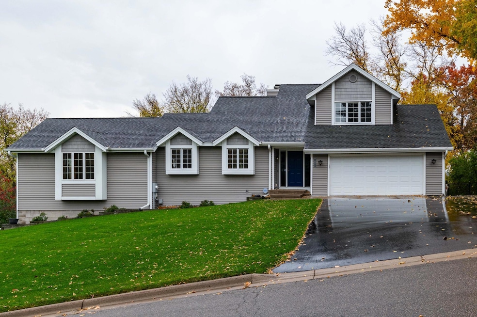 Welcome to 10911 48th Av N.  This Attractive home sits atop on a half acre lot with a private backyard and stunning seasonal views of the Minneapolis skyline.