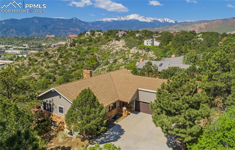 Exceptional location with Pikes Peak and Garden of the Gods views in the highly desirable Pinecliff neighborhood.