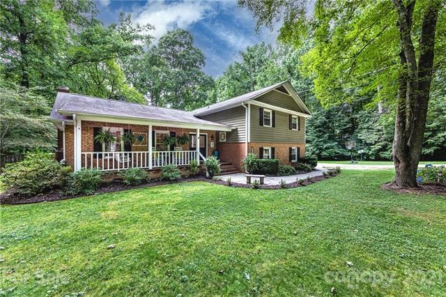 Welcome home to 7641 Timber Ridge Drive in the picturesque neighborhood of Farmwood in Mint Hill!