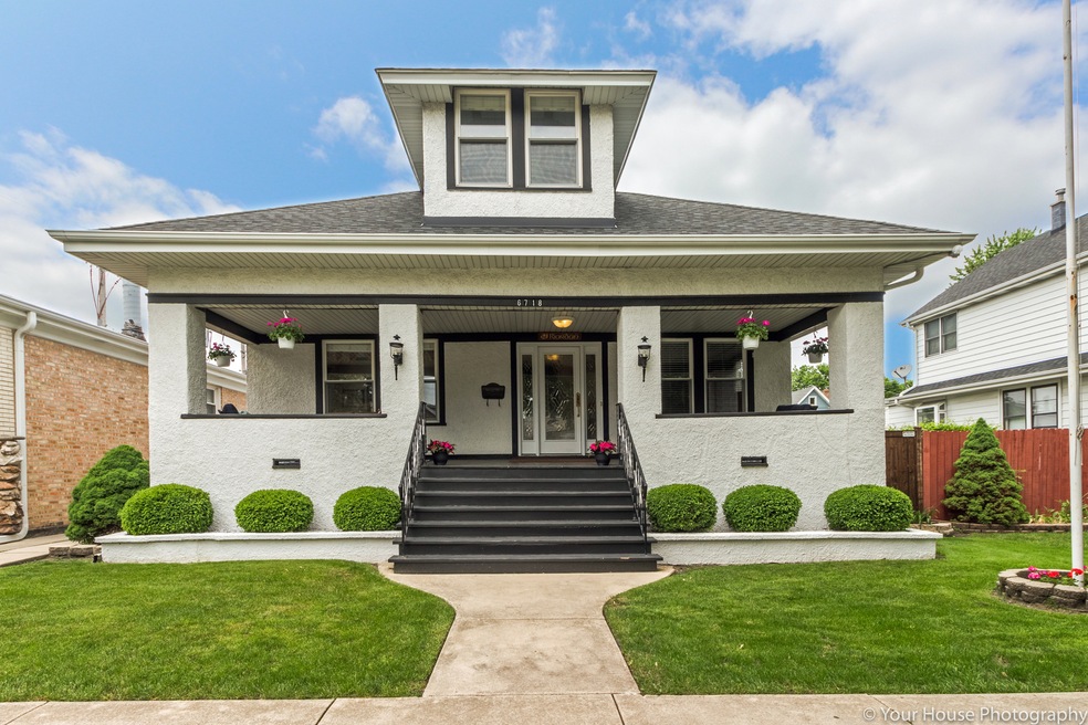 Street view the black & white stucco home commands