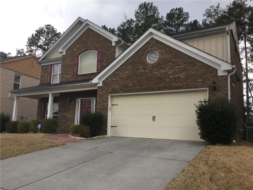 Traditional-style house with brick siding, an atta