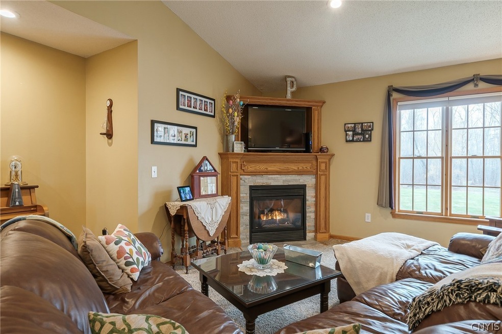 THE OPEN FLOOR PLAN WITH CATHEDRAL CEILING SIN THE