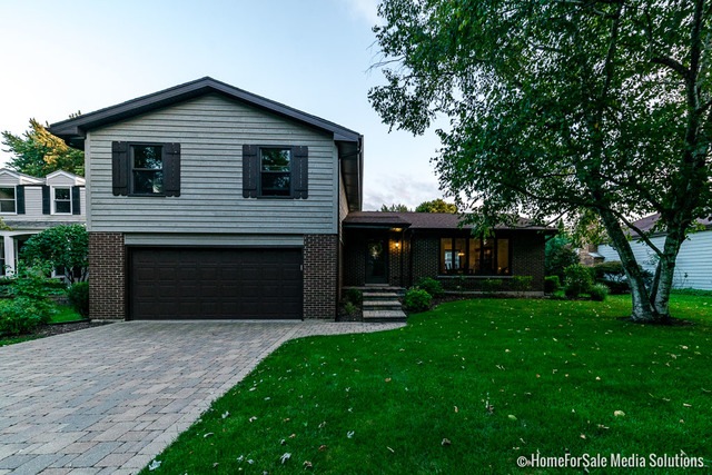 Great Curb Appeal with beautiful brick paver drive