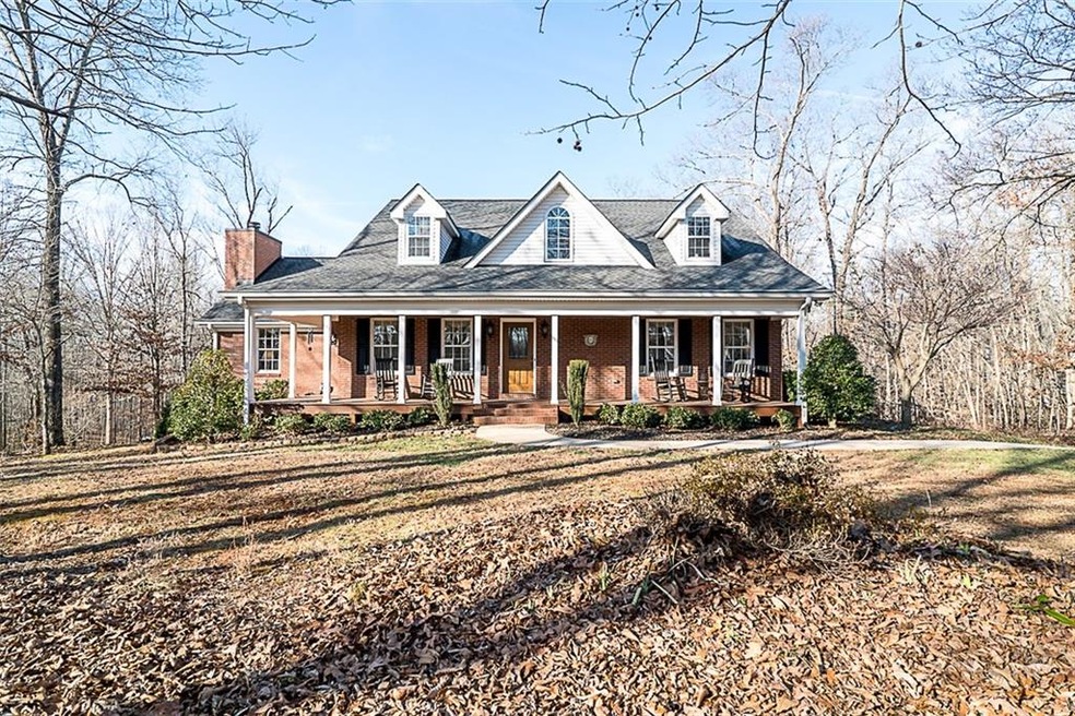 This gorgeous Cape Cod sets on over 1-acre lot and