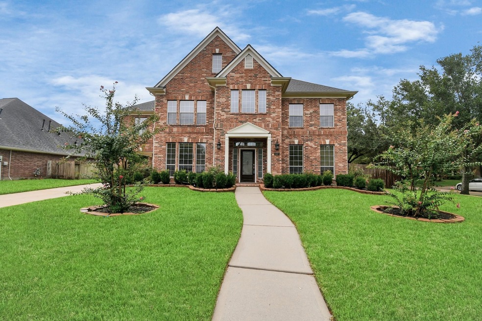 Charming two-story corner lot home with a covered