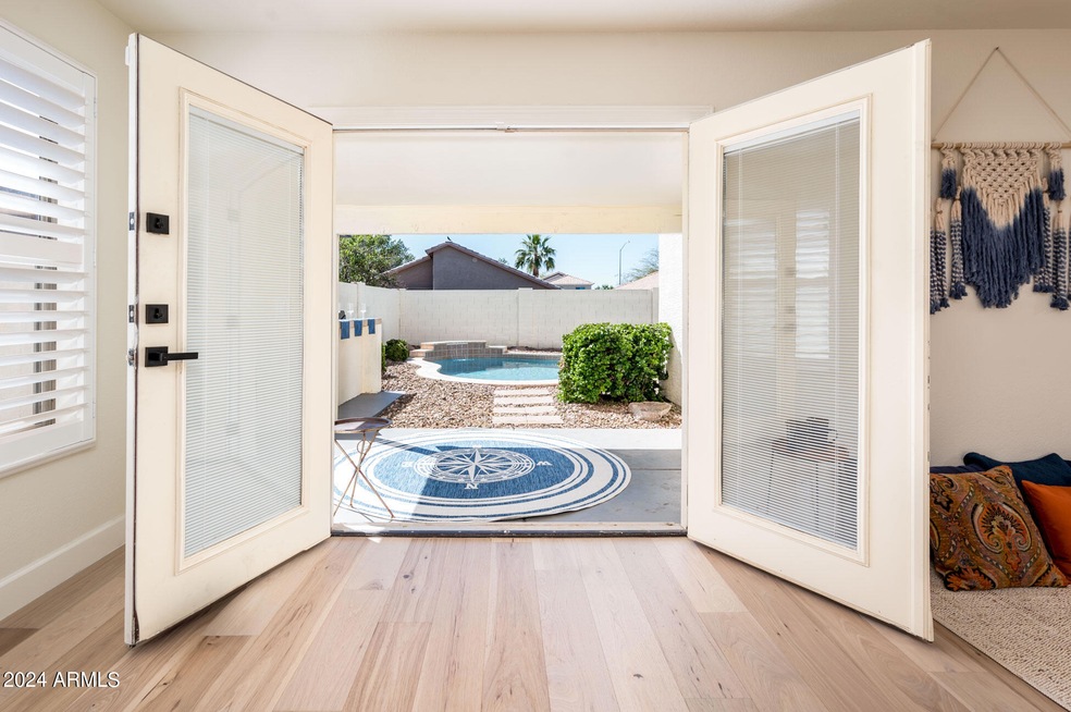 Double doors open to private pool