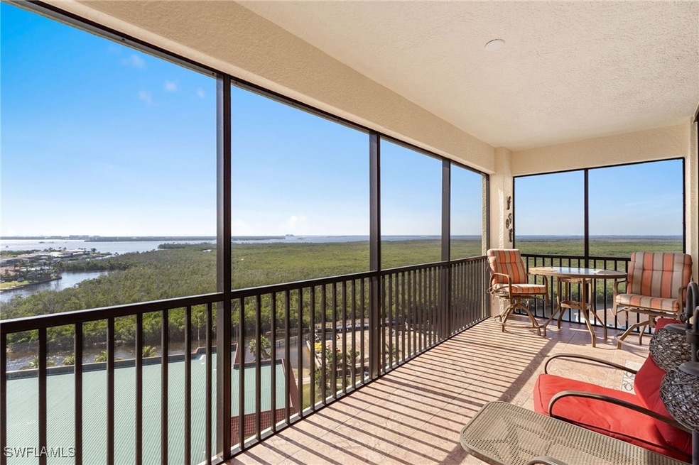 Sunroom / solarium with a water view