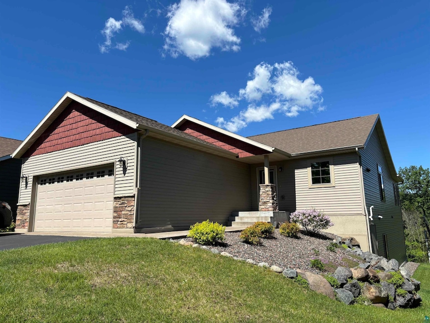 View of front of property with a front yard and a 