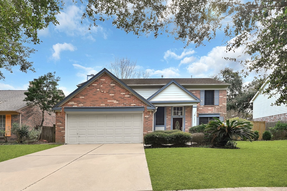 A charming two-story brick home with a classic gab