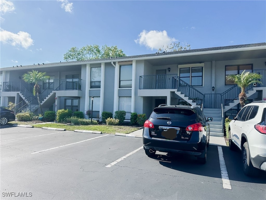View of building exterior featuring stairs and unc