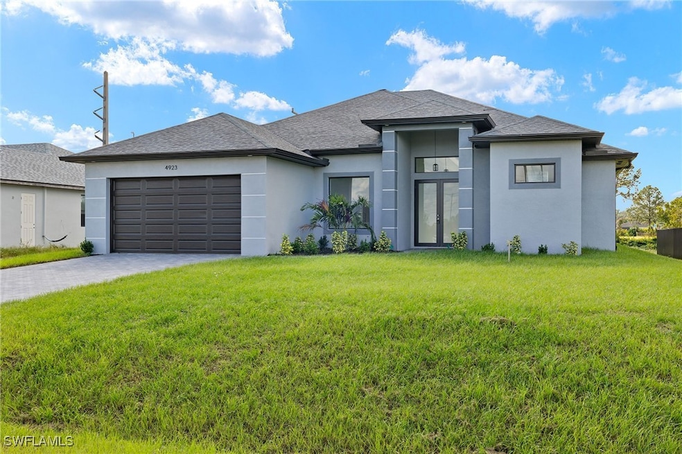 View of front facade featuring a garage and a fron