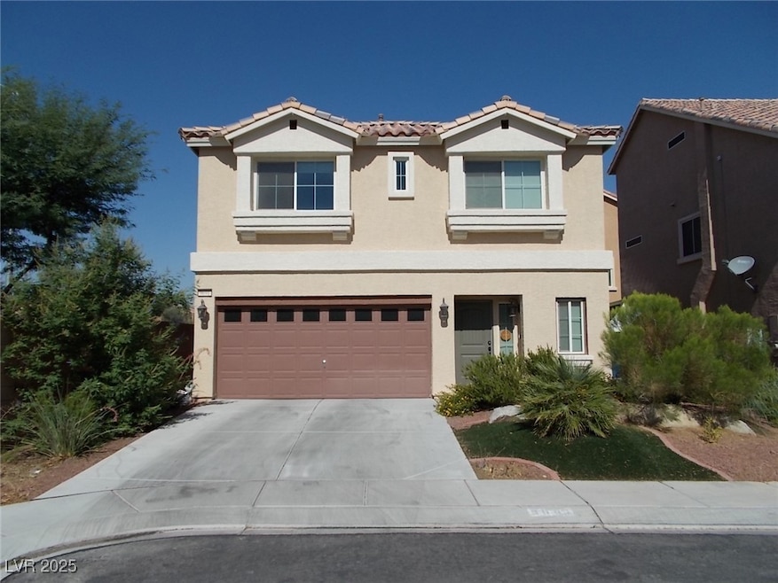 View of front of home with stucco siding, concrete