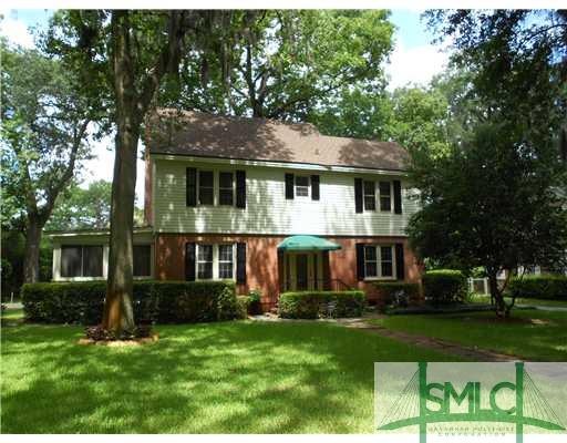 Exterior Front. MANICURED YARD AND FRONT ENTRY....