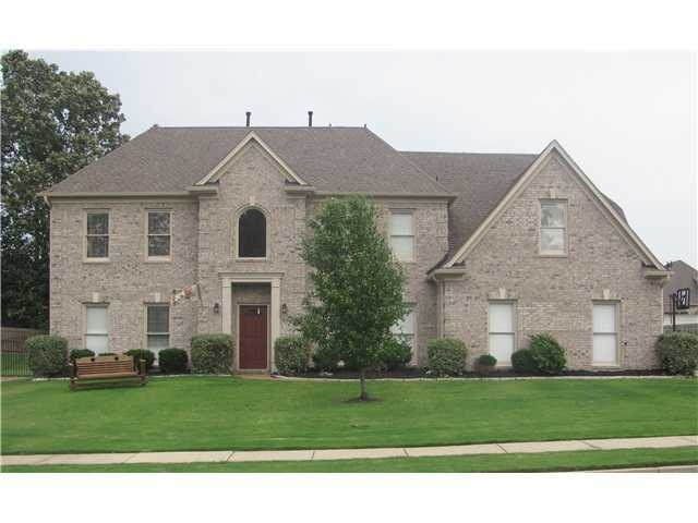 This lovely 5BR brick home has loads of curb appea