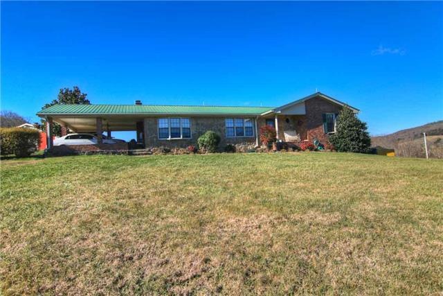 Metal roof, mostly brick and covered front porch.
