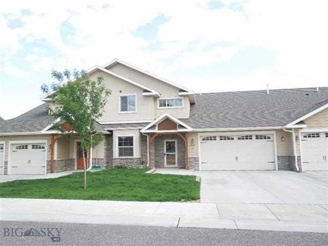 Front with double attached garage.