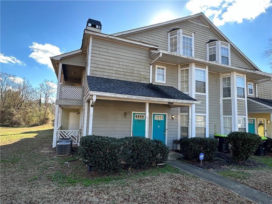 View of front of home featuring central AC and a b