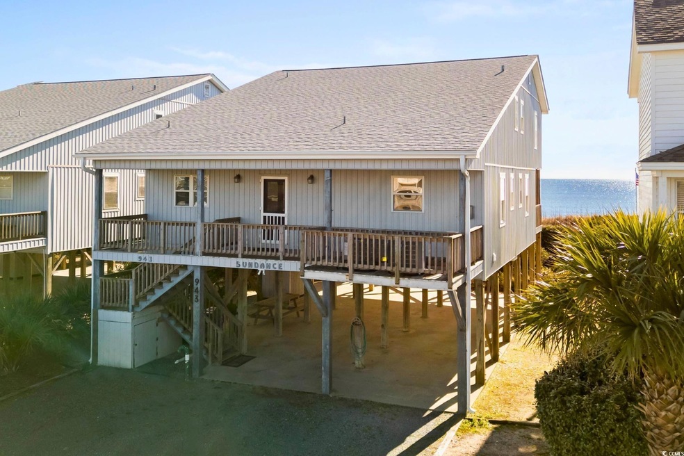Back of property featuring a carport and a water v