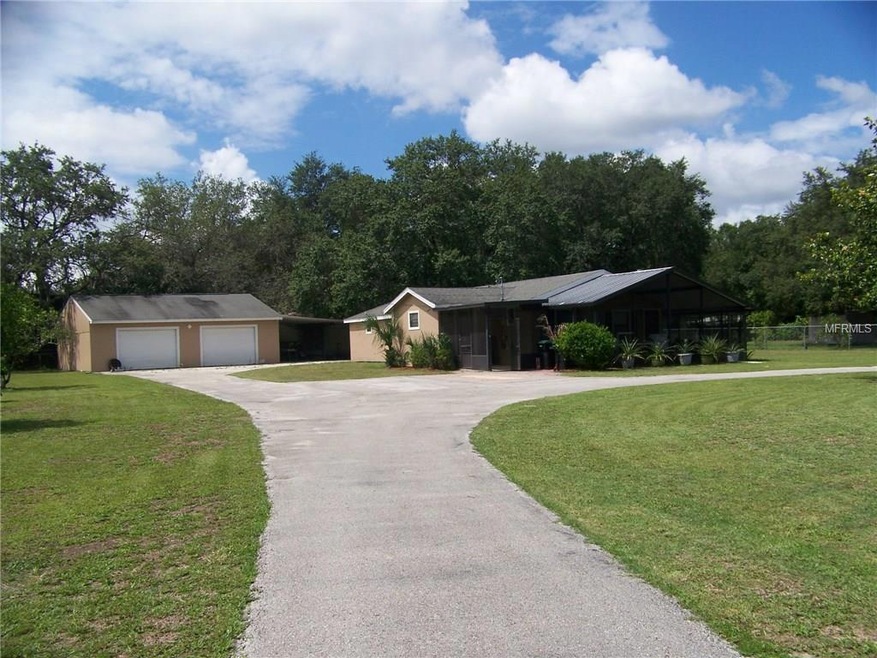 Your Slice of the Country....Over and Acre with 4-car garage and RV/Boat Space