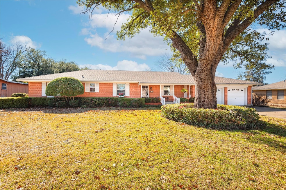 Ranch-style house with a  two car garage and a fro