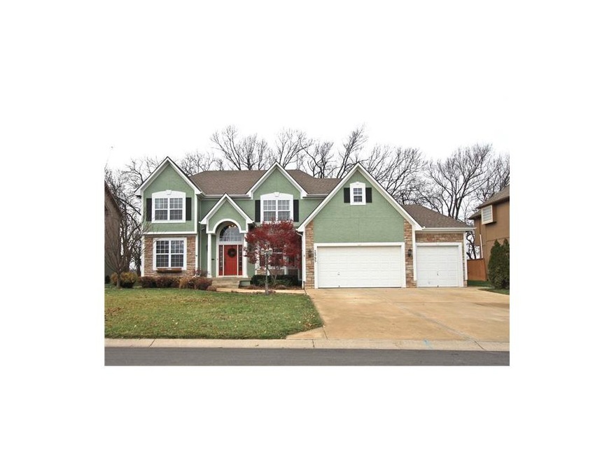 Front of home with flat driveway.