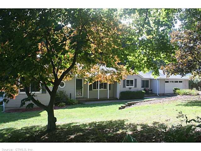 Exterior Front. Sprawling ranch with 2 car garage
