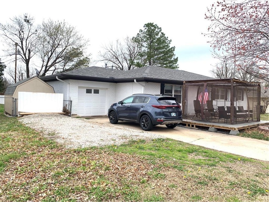 One car garage, gravel extra parking storage build