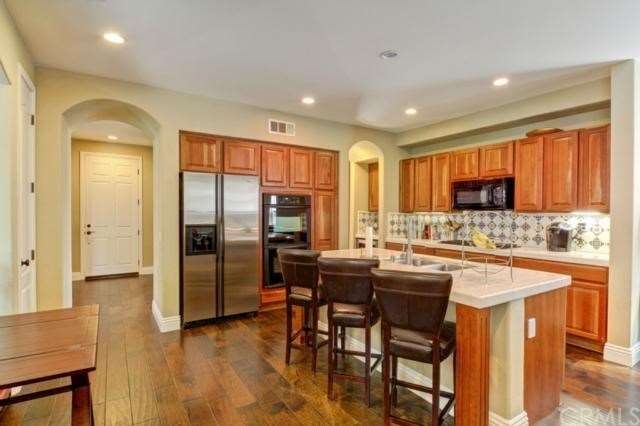 Immaculate Kitchen Features Large Island with Bar 
