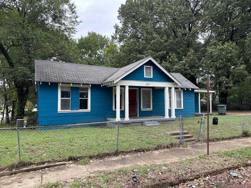 Bungalow with a front yard and a porch