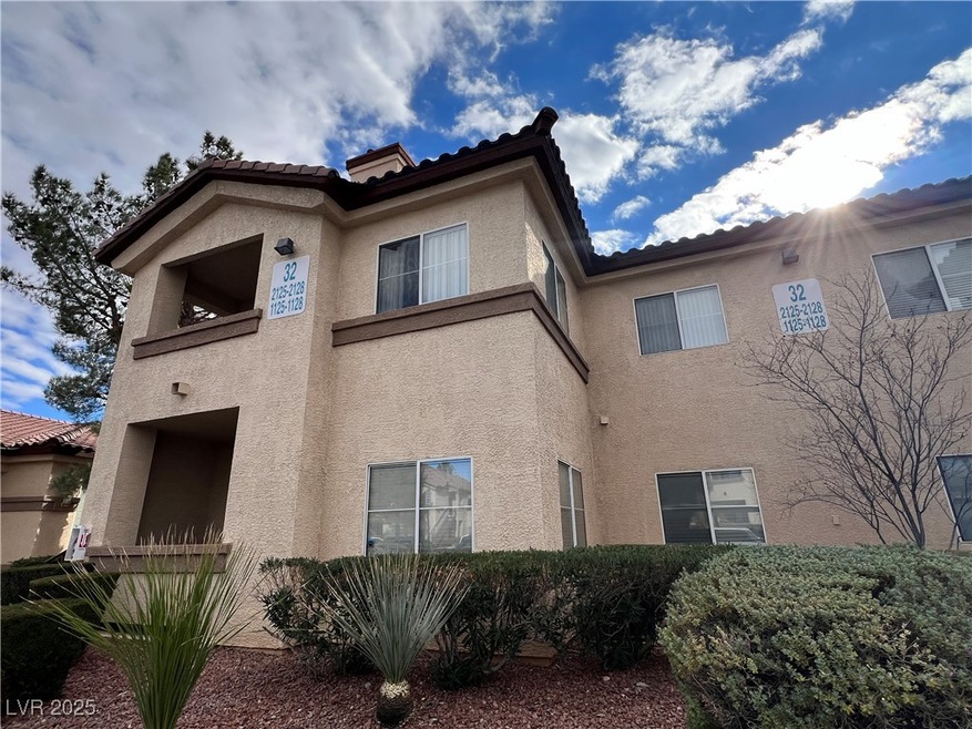 View of side of property featuring stucco siding a