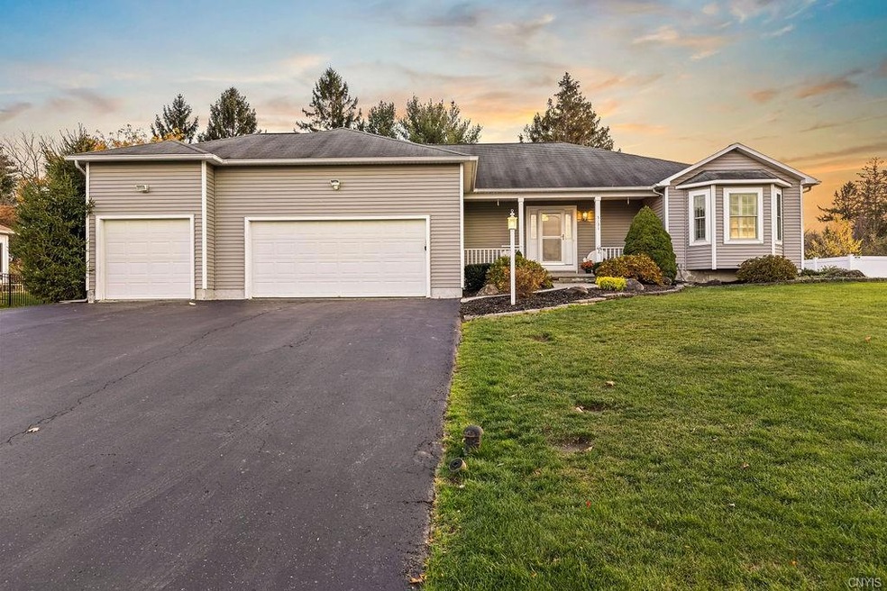 Welcome to this custom built ranch with 3 car gara