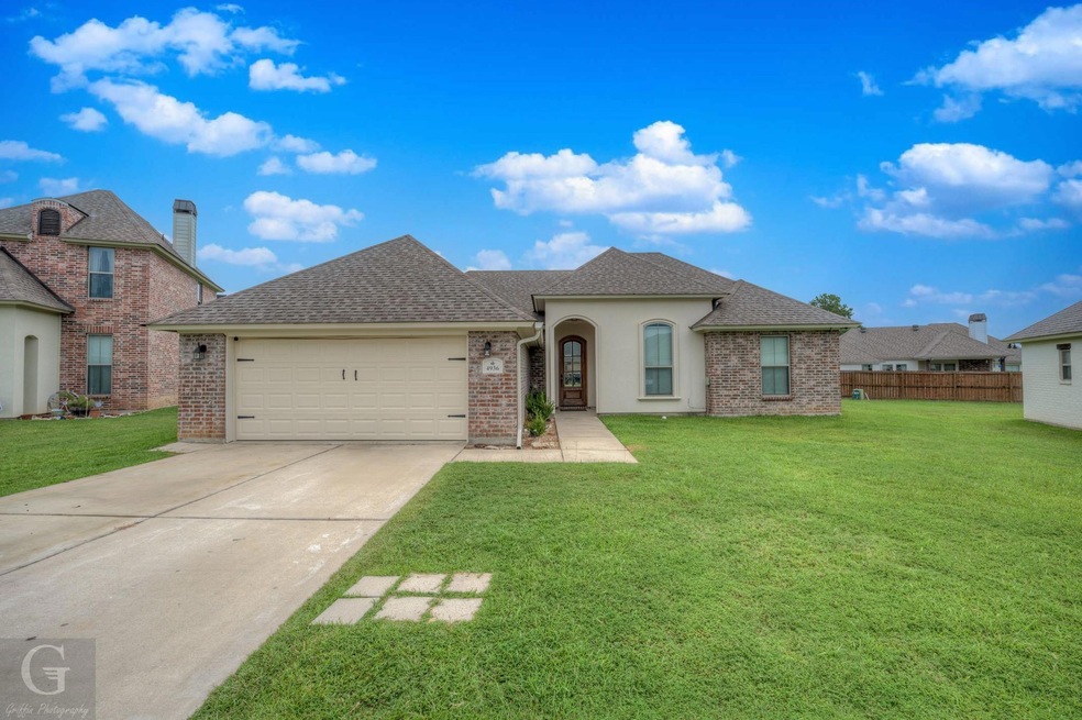 View of front facade featuring a garage and a fron