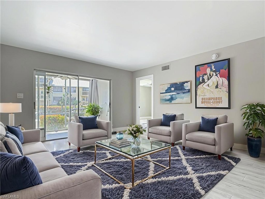 Living room with visible vents and baseboards