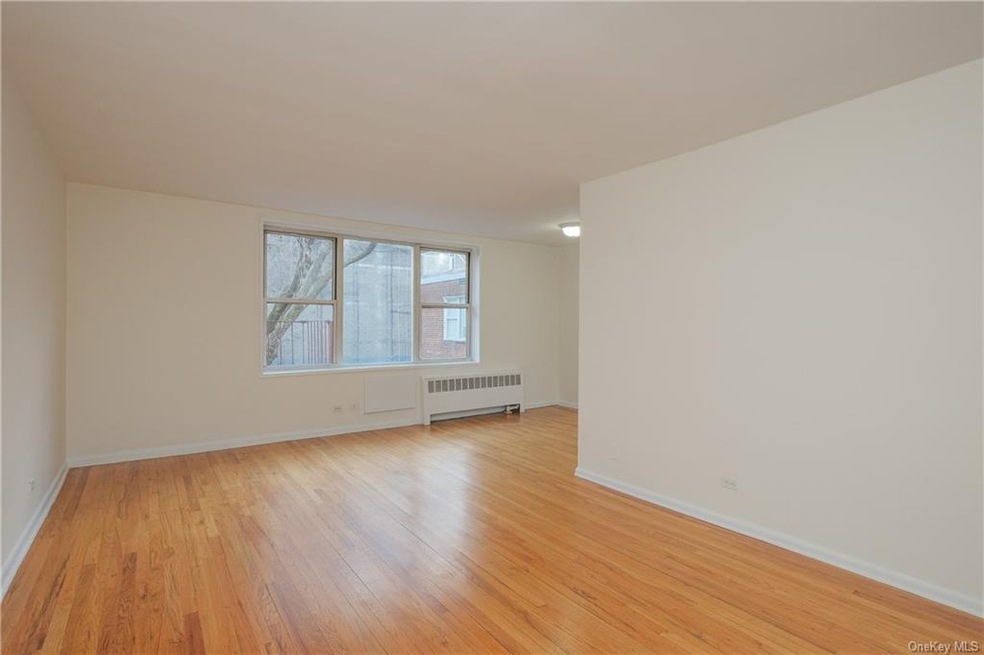 APT. 6-B  View of top floor L-shaped Living Room &