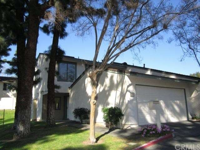 Tall pines shade the path to your front door. Just